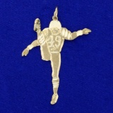 Diamond Cut Football Player Pendant In 14k Yellow Gold