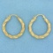 Twisting Hoop Earrings In 10k Yellow Gold