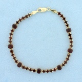 4ct Tw Garnet Line Bracelet In 14k Yellow Gold