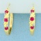 2/3ct Tw Ruby And Diamond Hoop Earrings In 10k Yellow Gold