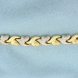 Two Tone Heart Link Bracelet In 14k Yellow Gold
