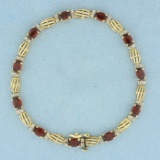 6ct Tw Garnet And Diamond Line Bracelet In 14k Yellow Gold