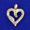 3/4ct Tw Round And Baguette Cut Diamond Heart Pendant In 10k Yellow Gold