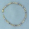 Tanzanite And Diamond Tennis Bracelet In 10k Yellow Gold