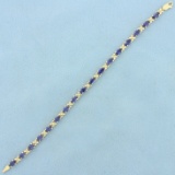 8.5ct Tw Tanzanite Flower Design Line Bracelet In 14k Yellow Gold