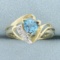 Blue Topaz And Diamond Bypass Ring In 10k Yellow Gold