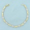 Diamond X And O Link Tennis Bracelet In 10k Yellow Gold