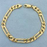 Mens 8 1/4 Inch Figaro Curb Link Bracelet In 14k Yellow Gold