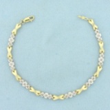 Diamond X And O Link Tennis Bracelet In 10k Yellow Gold