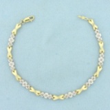 Diamond X And O Link Tennis Bracelet In 10k Yellow Gold
