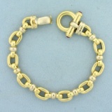 Designer Cable Link Bracelet With Ruby Clasp In 18k Yellow Gold