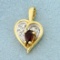 Garnet And Diamond Heart Pendant In 14k Yellow And White Gold