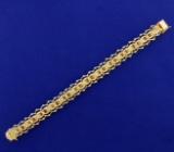Designer Woven Style Charm Bracelet In 14k Yellow Gold