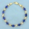 13ct Tw Lab Sapphire And Diamond Line Bracelet In 10k Yellow And White Gold