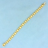 Diamond Cut X And O Link Bracelet In 14k Yellow Gold