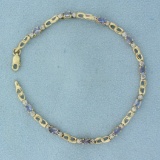 Tanzanite And Diamond Tennis Bracelet In 10k Yellow Gold