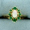 Opal And Emerald Halo Ring In 14k Yellow Gold