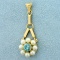 Blue Topaz And Pearl Flower Dangle Pendant In 14k Yellow Gold