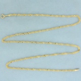 18 Inch Twisting Curb Link Chain Necklace In 14k Yellow Gold