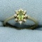 Peridot And Diamond Flower Design Ring In 10k Yellow Gold