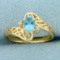 Swiss Blue Topaz And Diamond Ring In 14k Yellow Gold