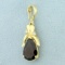Garnet And Diamond Pendant In 14k Yellow Gold