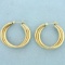 Twisting Hoop Earrings In 14k Yellow Gold
