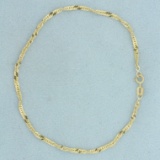 Italian Made Twisting Curb Link Chain Bracelet In 10k Yellow Gold