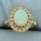 Antique Opal And Sapphire Halo Ring In 10k Yellow Gold