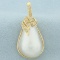 Large Mabe Pearl And Diamond Pendant In 14kk Yellow Gold