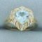 Heart Shaped Blue Topaz And Diamond Ring In 14k Yellow And White Gold