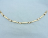 Two Tone X Link Bracelet In 14k Yellow And White Gold