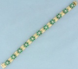 Emerald And Diamond Flower Design Bracelet In 14k Yellow Gold