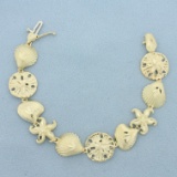 Diamond Cut Sealife Shell Starfish And Sand Dollar Bracelet In 14k Yellow Gold
