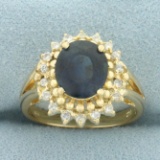 Sapphire And Diamond Princess Diana Halo Ring In 14k Yellow Gold
