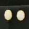 Oval Opal Stud Earrings In 14k Yellow Gold