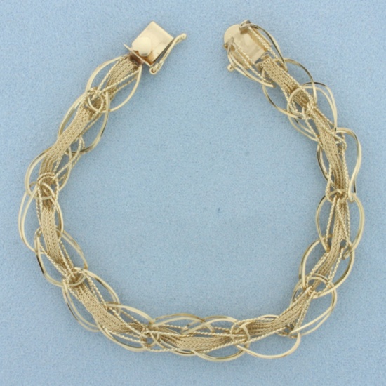 Unique Oval And Wheat Link Charm Bracelet In 14k Yellow Gold