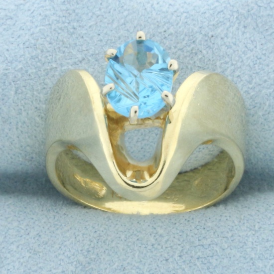 Fancy Oval Cut Swiss Blue Topaz Ring In 14k Yellow Gold