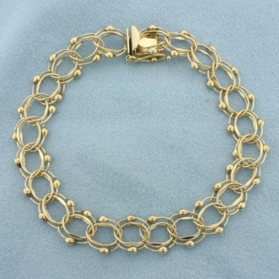 Double Loop Charm Bracelet In 14k Yellow Gold
