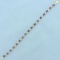 Aaa Tanzanite Flower Design Line Bracelet In 14k Yellow Gold