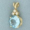 Blue Topaz And Diamond Pendant In 14k Yellow Gold