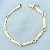 Two Tone Link Bracelet In 14k Yellow And White Gold