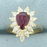 Pear Cut Ruby And Diamond Halo Ring In 14k Yellow Gold