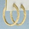 Diamond Cut Hoop Earrings In 14k Yellow Gold