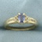 Tanzanite And Diamond Ring In 14k Yellow Gold