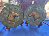 Copper hammered horse heads.