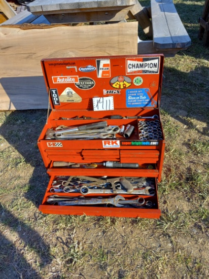 Red tool box full of tools
