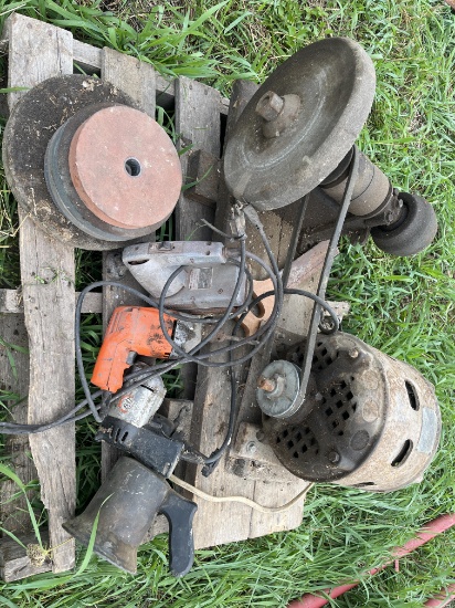 Electric motor running a grinding stone