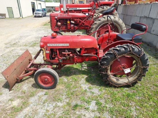 Farmall Cub low boy with snow plow an mower deck