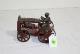 Antique cast iron tractor with driver toy